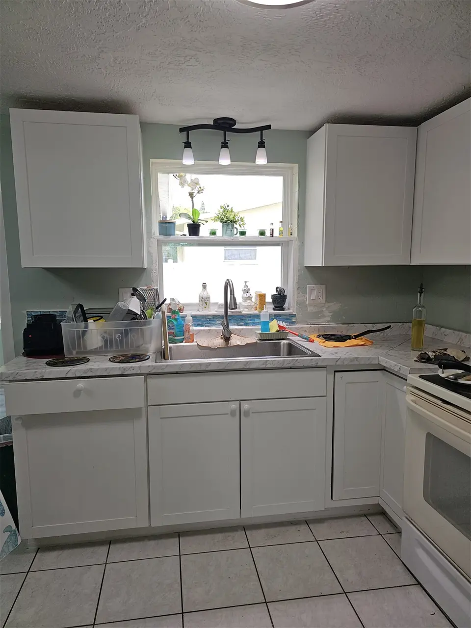 Finished kitchen cabinets and countertop from the sink side