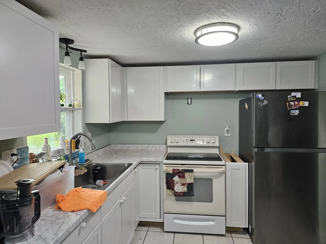 Finished white kitchen cabinets installed by iFIXED